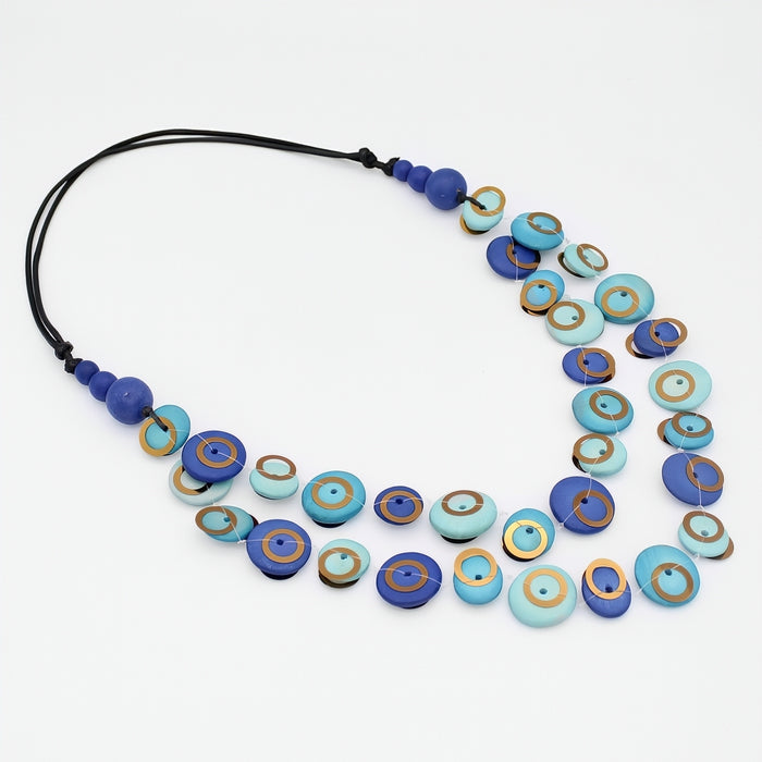 Necklace with blue and turquoise beads on a white background