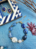 This exquisite bracelet features genuine agate stones, each uniquely patterned, accompanied by the organic allure of baroque pearls and the timeless charm of freshwater pearls.
