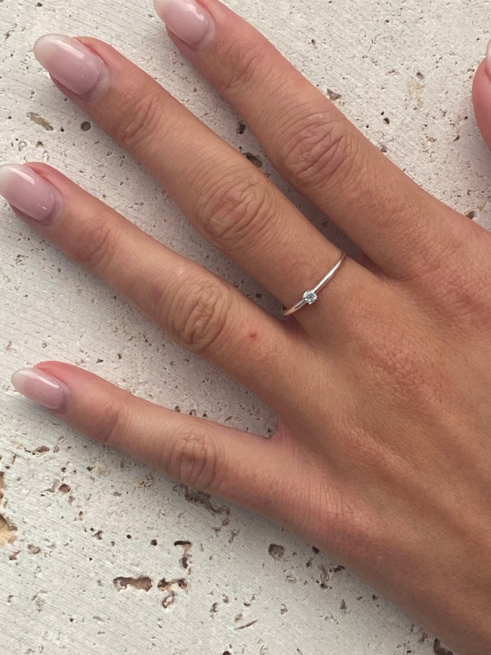 Dainty ring with light blue gemstone