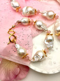 Elevate your look with the unique charm of Baroque pearls and the soothing essence of Rose Quartz – a must-have addition to your jewelry collection.