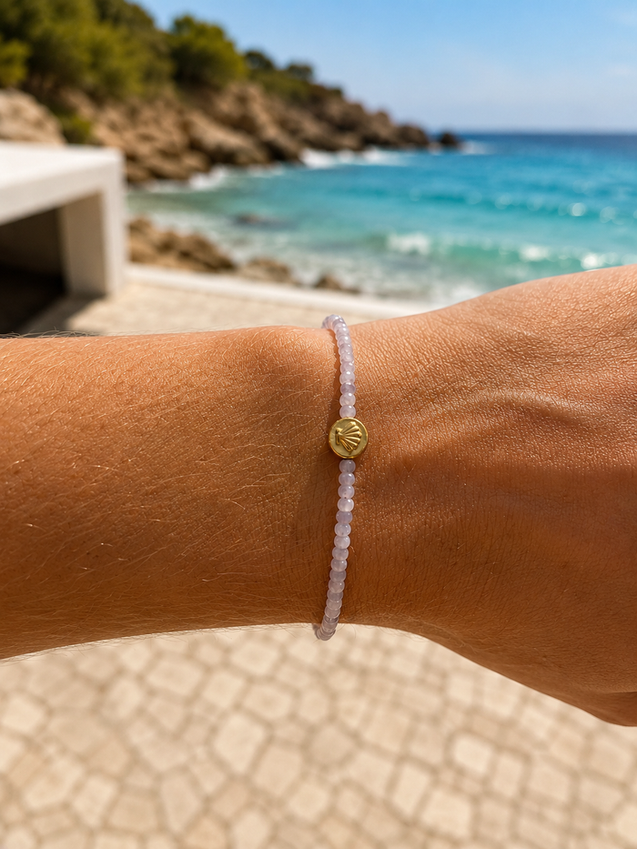 Beach Lavender Love Bracelet crafted with natural faceted kunzite gemstones and gold vermeil shell detail, inspired by the Australian coastline.