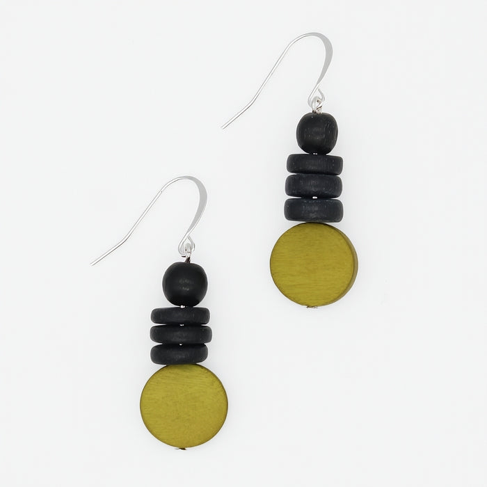 Pair of earrings with black and gold circular beads on a white background