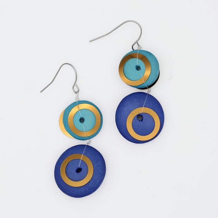 Earrings with circular design in blue, gold, and teal on a white background