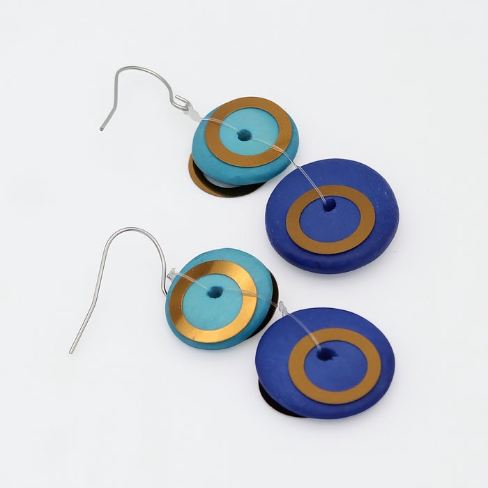 Colorful circular earrings on a white background