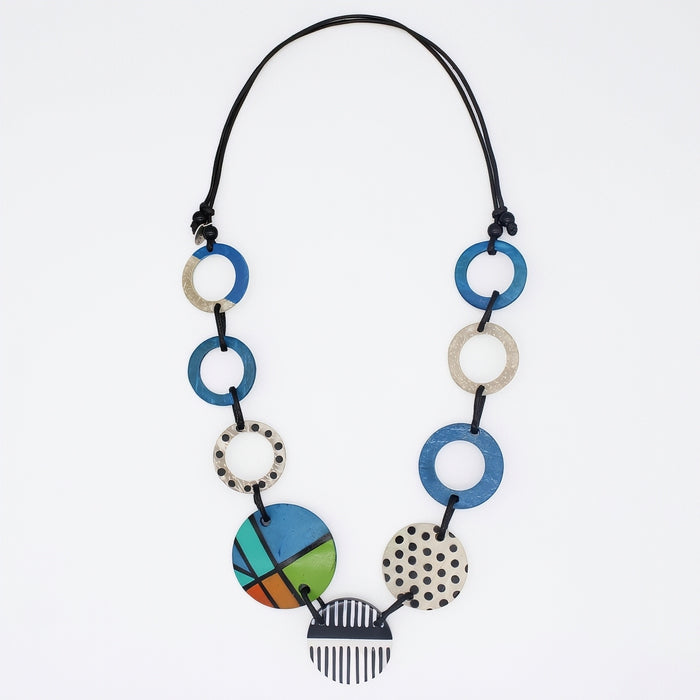 Necklace with colorful circular pendants on a white background