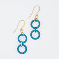 Pair of blue ring earrings with gold hooks on a white background