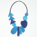 Necklace with blue geometric beads on a white background