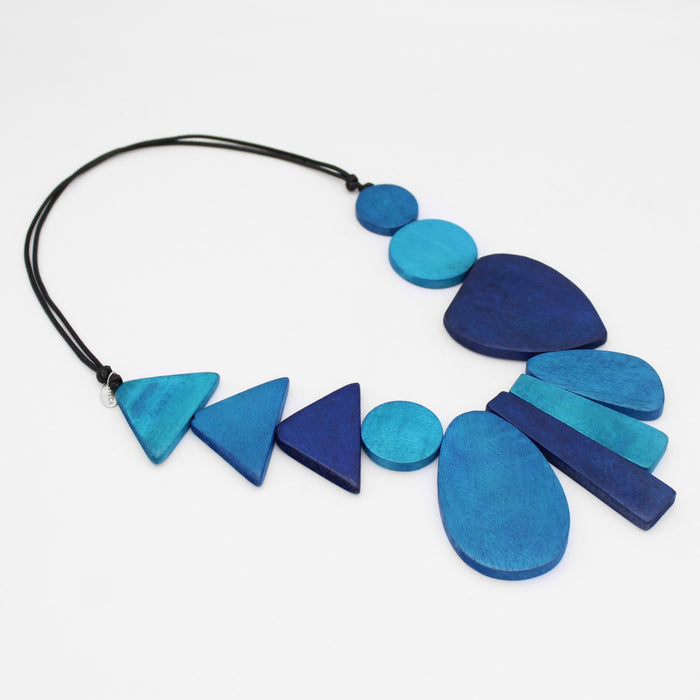 Blue geometric necklace on a white background