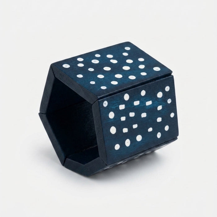 Bold blue wooden chunky bangle with white polka dots on a stretch cord. One size fits most — easy to stack or wear solo. Shop Sylca Designs.