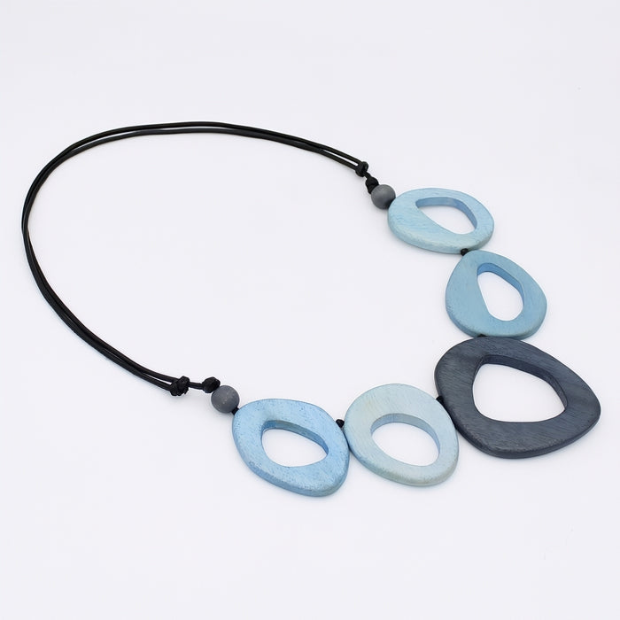 Necklace with blue and gray oval pendants on a white background