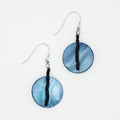 Blue circular earrings with black beads on a white background