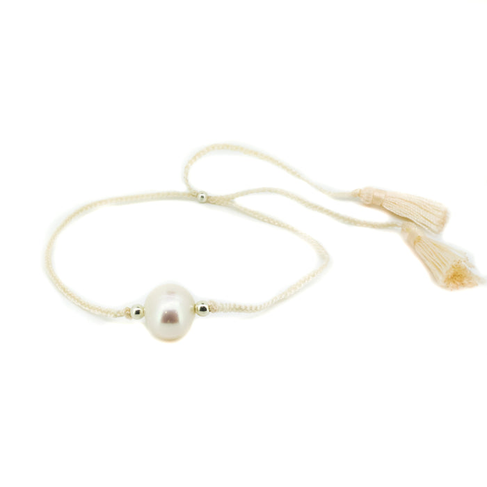 Boho Pearl Cream Tassel Bracelet featuring genuine freshwater pearls and cream tassel detail