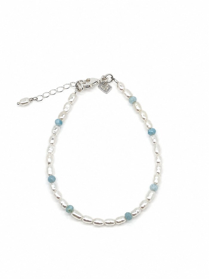 Boho Pearl Larimar Bracelet Silver featuring genuine freshwater seed pearls, soft blue larimar gemstones, sterling silver clasp, and adjustable chain.