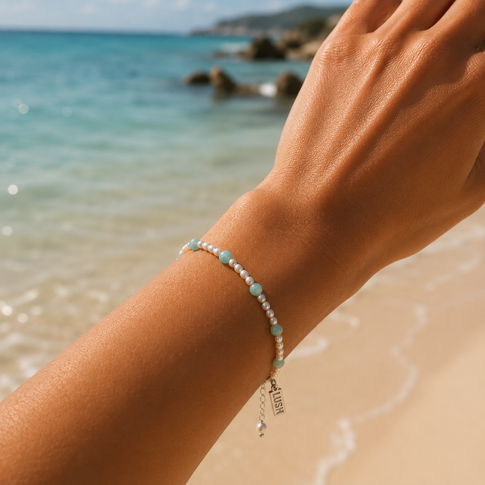 Boho Pearl Larimar Bracelet Silver featuring genuine freshwater seed pearls, soft blue larimar gemstones, sterling silver clasp, and adjustable chain.