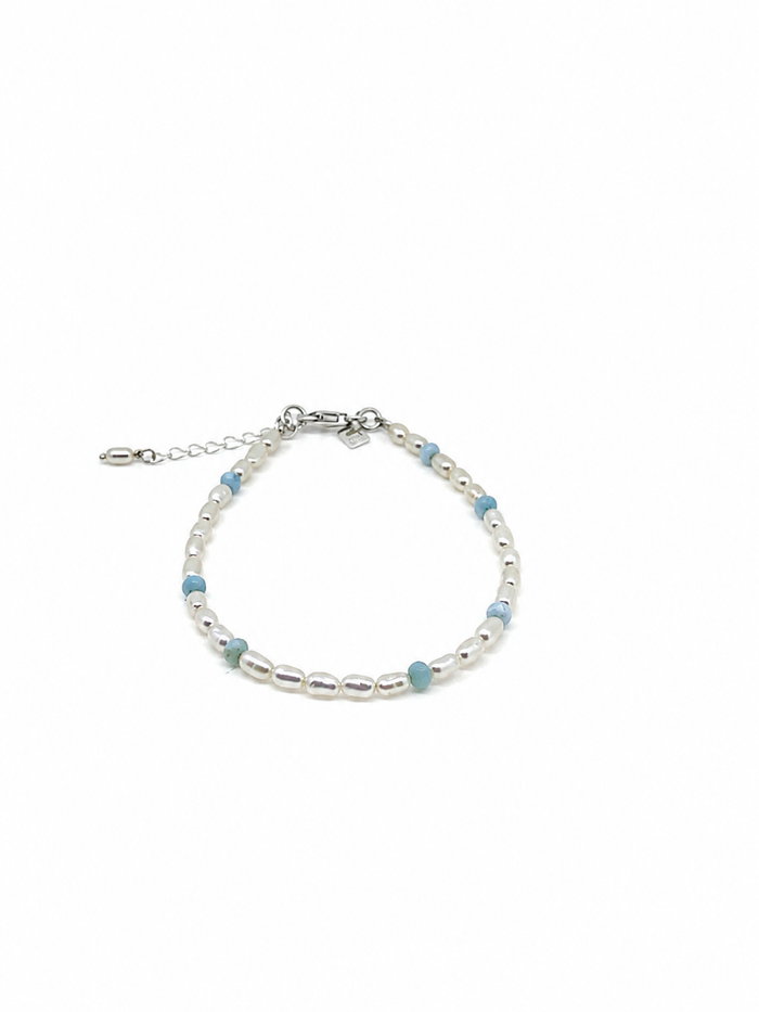 Boho Pearl Larimar Bracelet Silver featuring genuine freshwater seed pearls, soft blue larimar gemstones, sterling silver clasp, and adjustable chain.