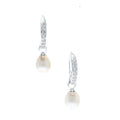 A pair of white pearl earrings with sterling silver hooks and cubic zirconia details.
