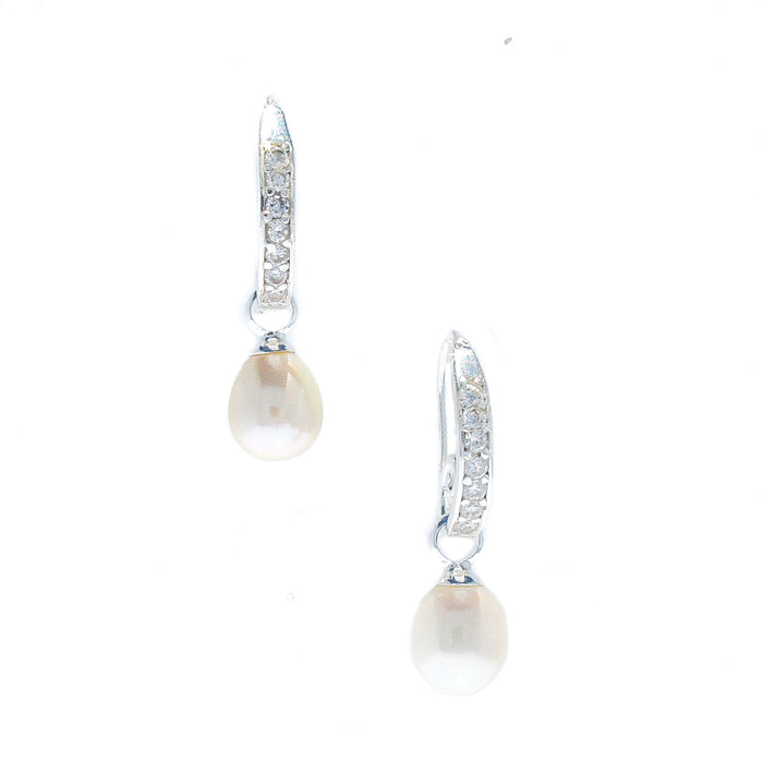 A pair of white pearl earrings with sterling silver hooks and cubic zirconia details.