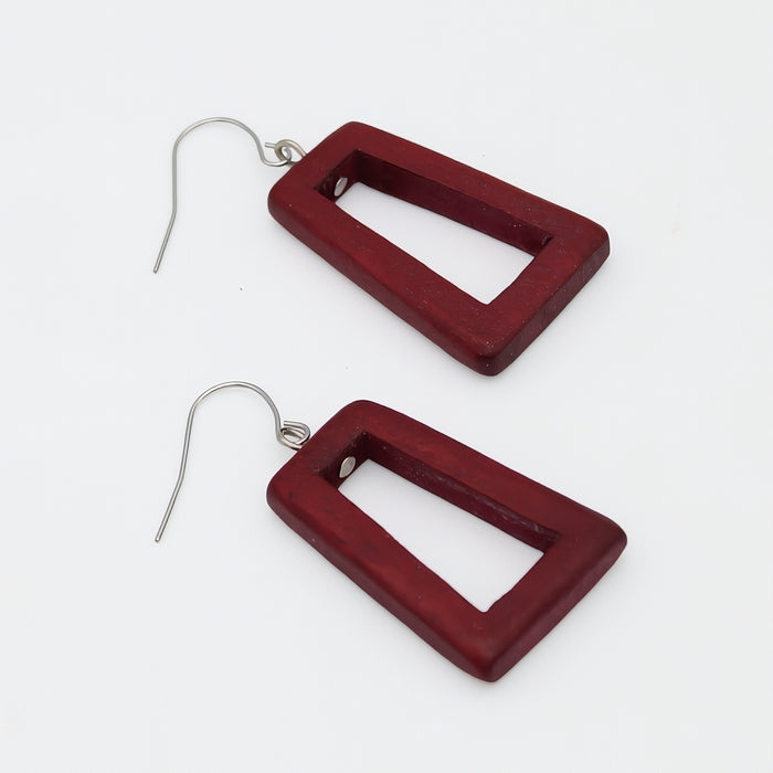 Red square earrings on a white background