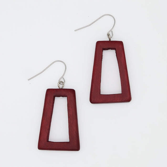 Red geometric earrings on a white background