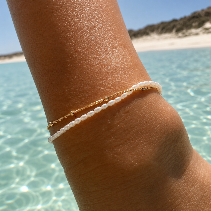 Cascade Pearl Bracelet Gold crafted with genuine freshwater pearls, premium gold vermeil chain, and elegant layered detailing inspired by the Australian coast.