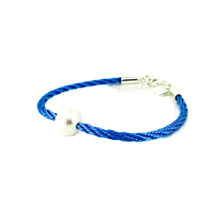 childrens freshwater pearl bracelet on blue braided cord