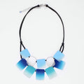 Necklace with blue and white square pendants on a white background