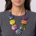 Woman wearing a large colorful statement necklace