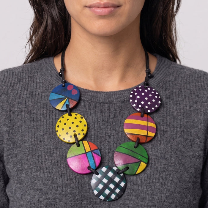 Woman wearing a large colorful statement necklace