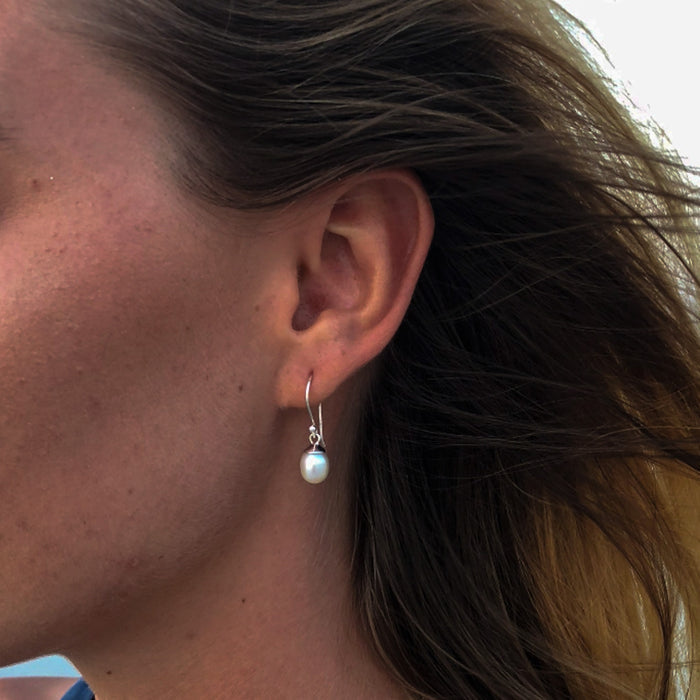 dainty white pearl earrings on sterling silver hooks