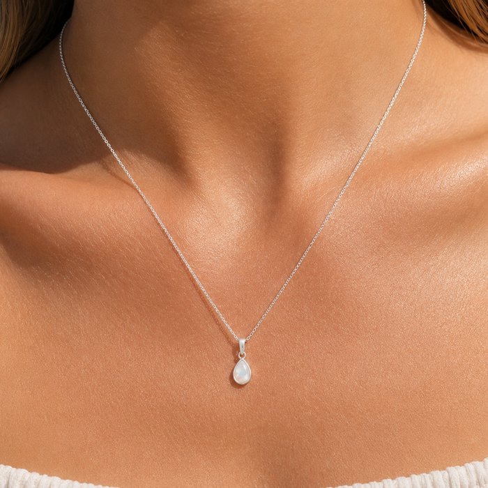 dainty pendant in the shape of morning dew drop infilled with mother of pearl shell designed in broome western australia by lush designs jewellery