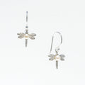 A pair of sterling silver hook earrings featuring a detailed dragonfly design with a freshwater pearl positioned at the center of the dragonfly's body.