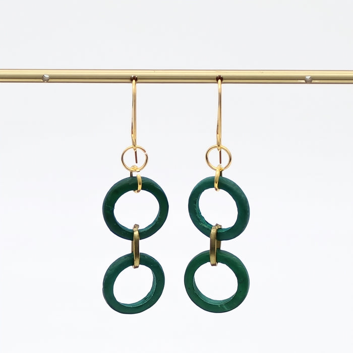 Green hoop earrings with gold hooks on a white background