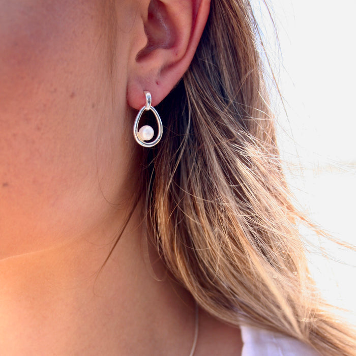 Silver loop with pearl attached earring