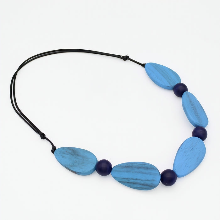 Necklace with blue and black beads on a white background