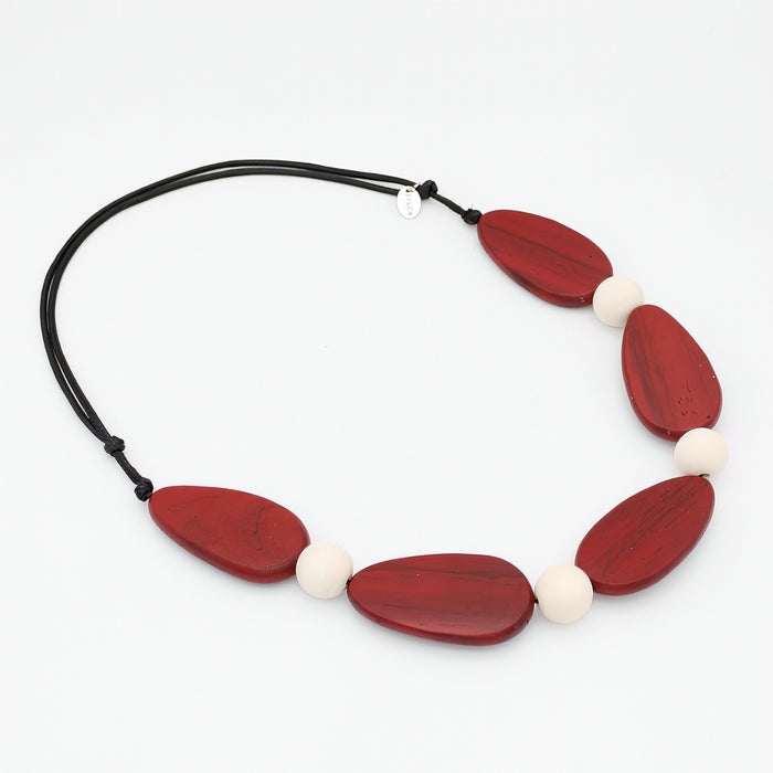 Necklace with red and white beads on a white background