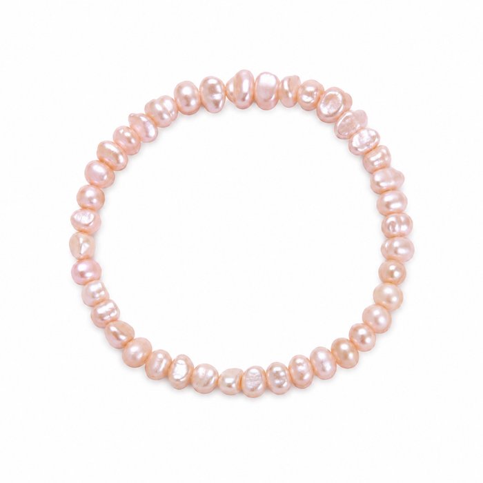 Delicate pink freshwater pearl stretch bracelet for girls, featuring natural blush-toned pearls and an easy elastic fit. Designed in Broome Western Australia.