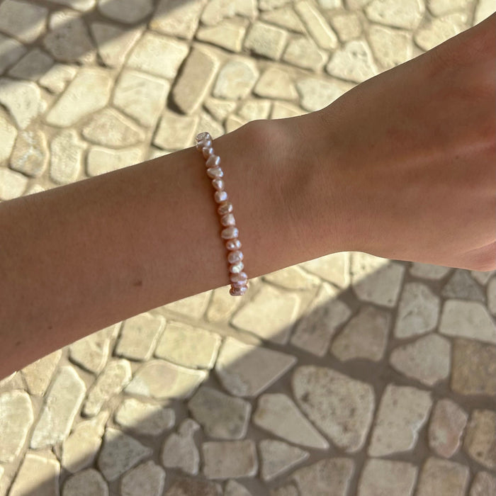 Delicate pink freshwater pearl stretch bracelet for girls, featuring natural blush-toned pearls and an easy elastic fit. Designed in Broome Western Australia.