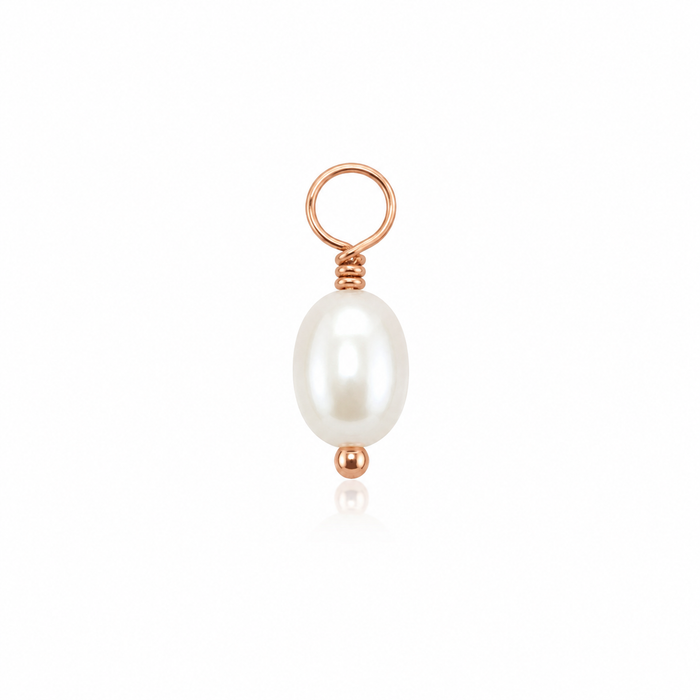 A rose gold pendant charm featuring a single white baroque pearl suspended from a matching rose gold loop with a small accent bead below