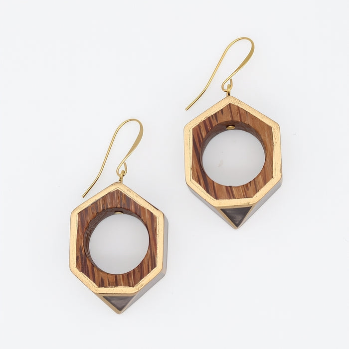 Hexagonal earrings with gold and wood accents on a white background