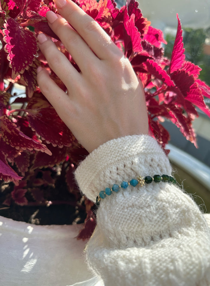 The natural gemstones not only add a pop of color to your ensemble but also harness the unique energies of Apatite and Agate, promoting balance and positivity.