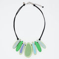 Necklace with green and blue pendant on a white background