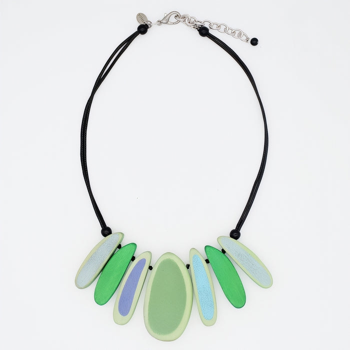 Necklace with green and blue pendant on a white background