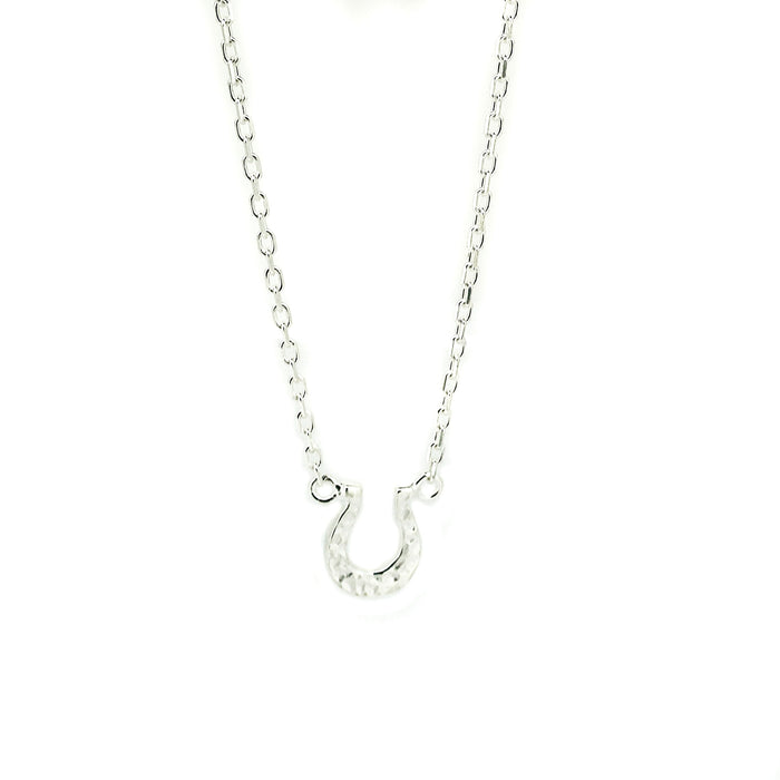 Sterling silver horseshoe necklace featuring a delicate lucky horseshoe pendant designed in Broome, Western Australia.