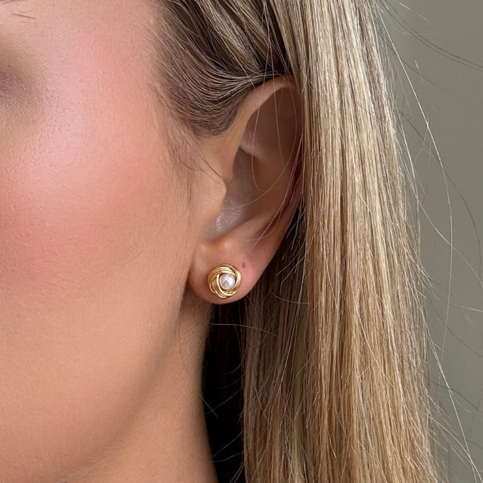 Pearl studs with gold around