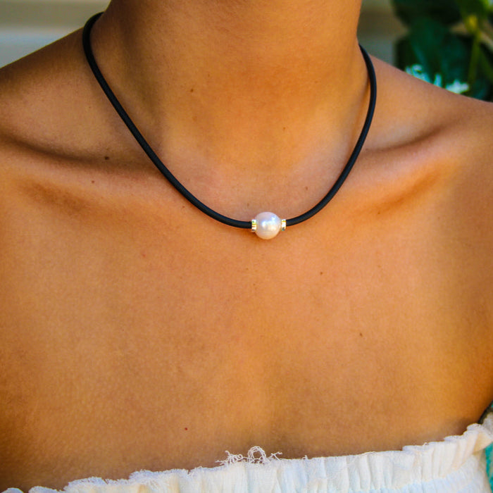 black necklace with pearl