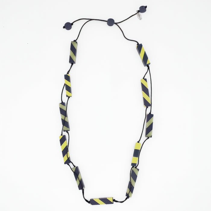Necklace with black and yellow striped pattern on a white background