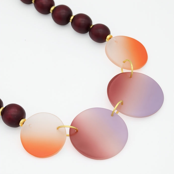 Necklace with gradient beads on a white background