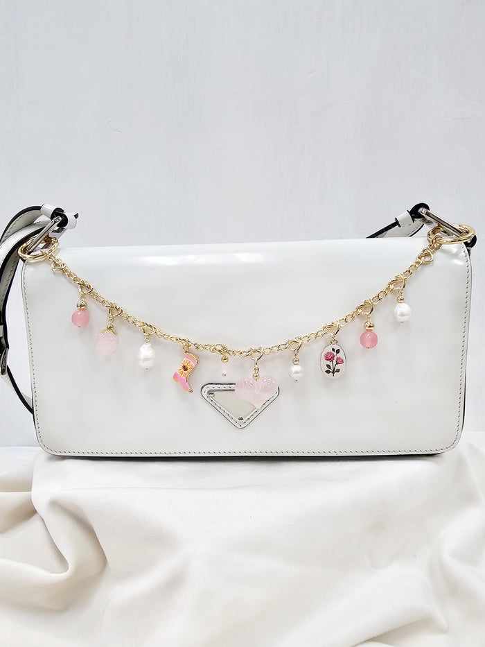 Meaningful Freshwater Pearls & Rose Quartz Chain Bag Charm featuring pearls and rose quartz accents.