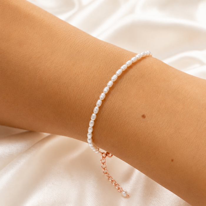 Mermaids Treasure Pearl Bracelet Rose Gold featuring genuine freshwater rice pearls accented with rose gold vermeil findings and an adjustable chain. A delicate coastal-inspired bracelet designed for effortless everyday elegance.