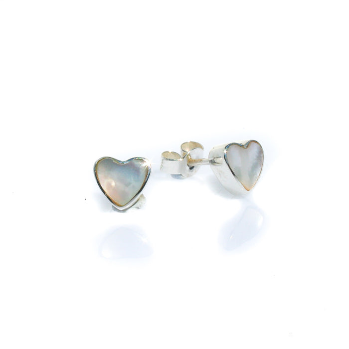 A pair of heart-shaped mother of pearl stud earrings set in sterling silver.